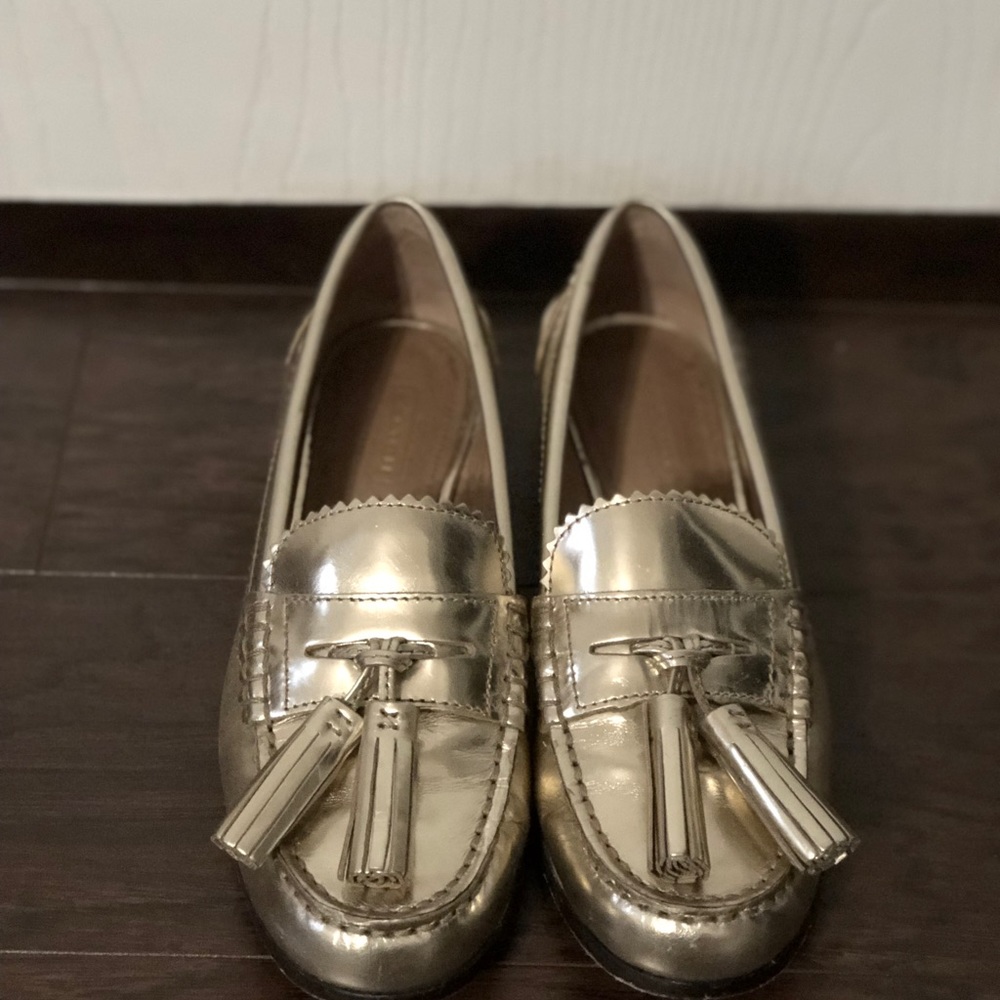 Gold coach loafers with tassels